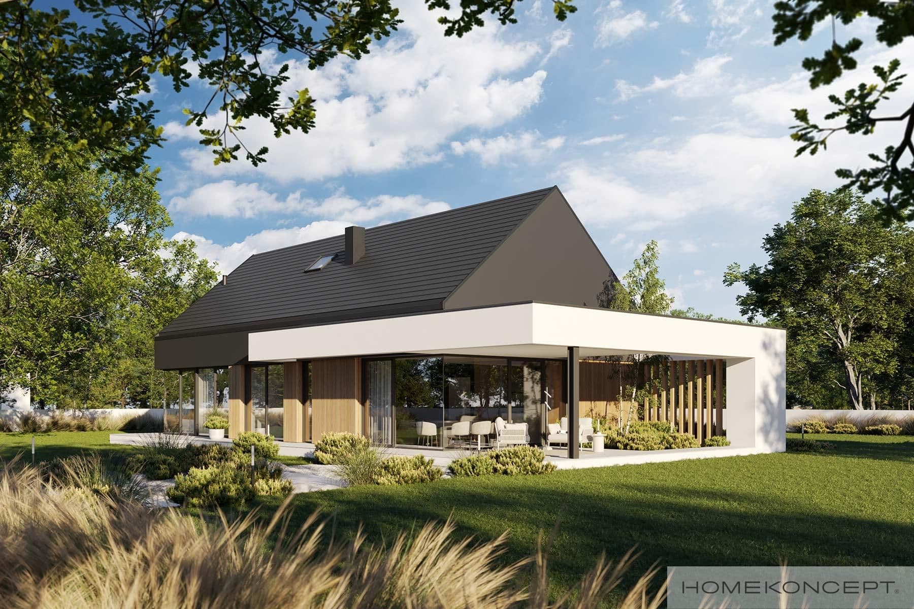 Modern house with dark gabled roof, large glass windows, and a surrounding green landscape.